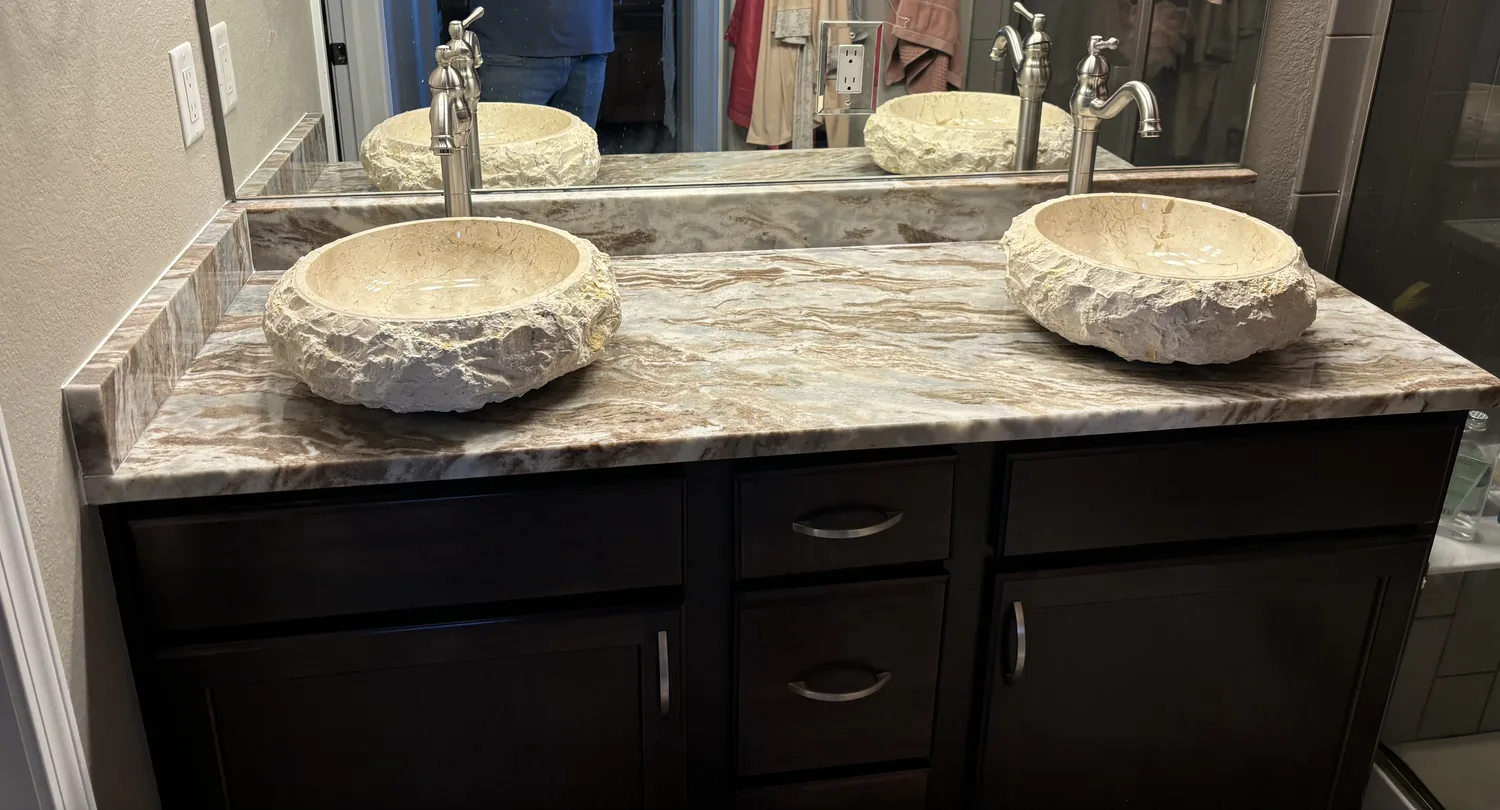 Bathroom vanity with stone countertop and vessel sink