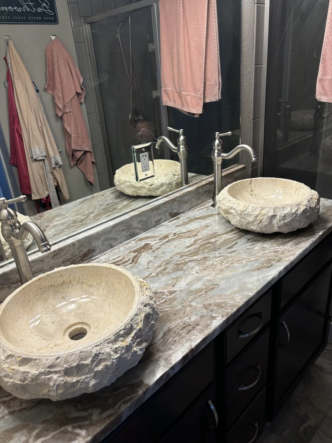 Close view of stone vanity top and vessel sink