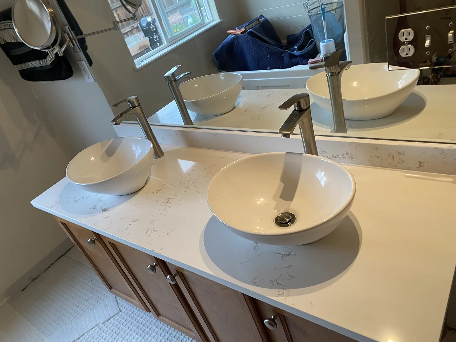 White double vanity with two sinks and stone surface