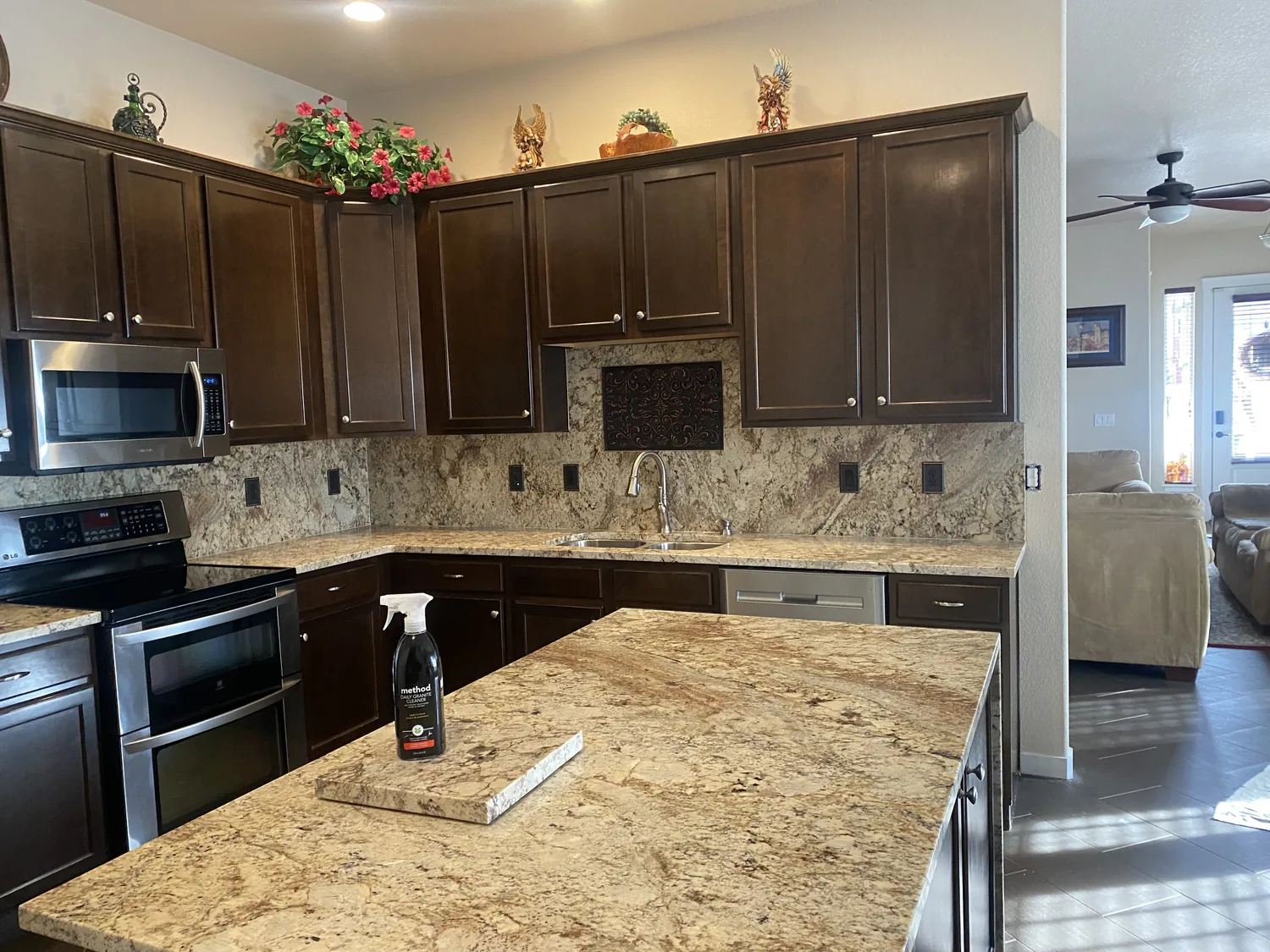 Dark cabinet kitchen with finished stone counters