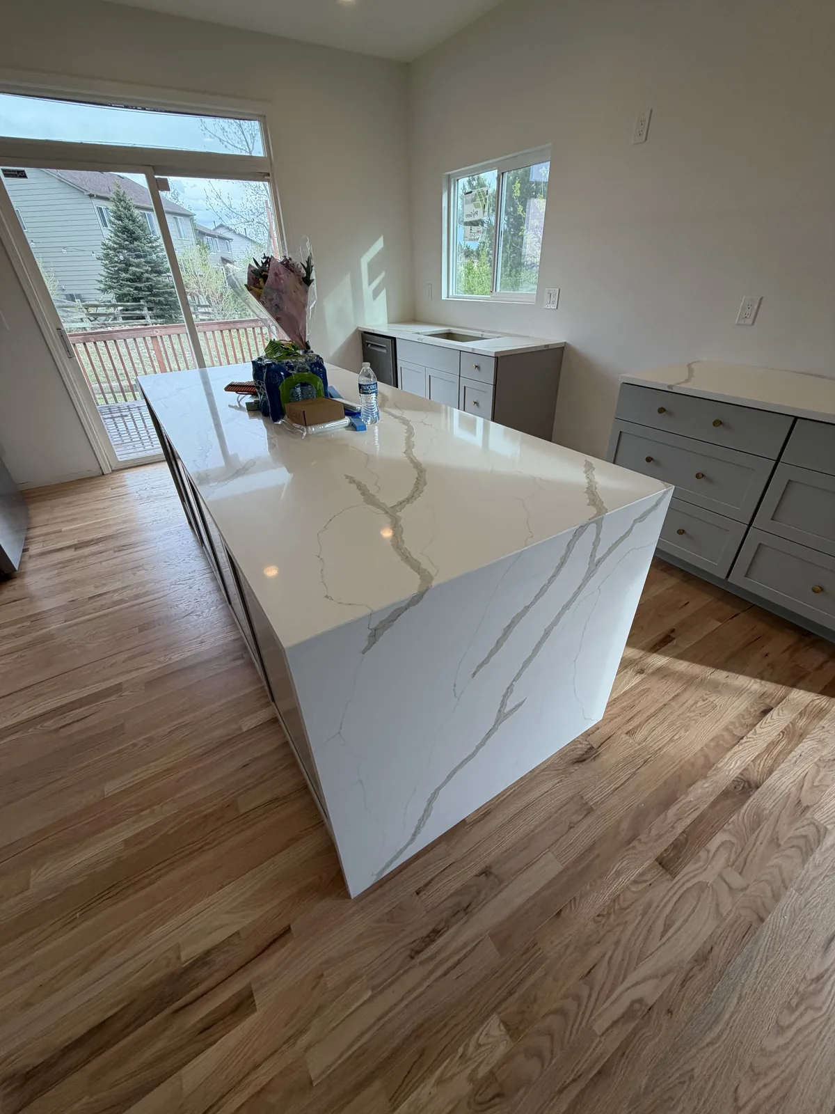 Finished double waterfall island viewed from above and beside the cabinets