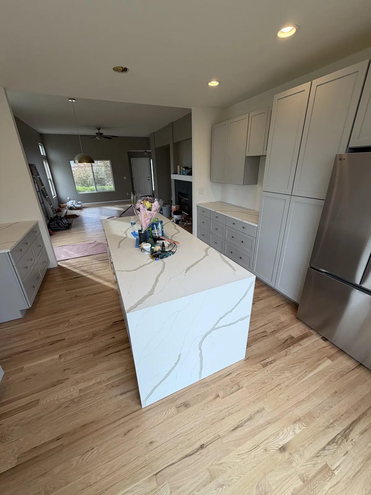 Finished double waterfall island and cabinet wall viewed from the side