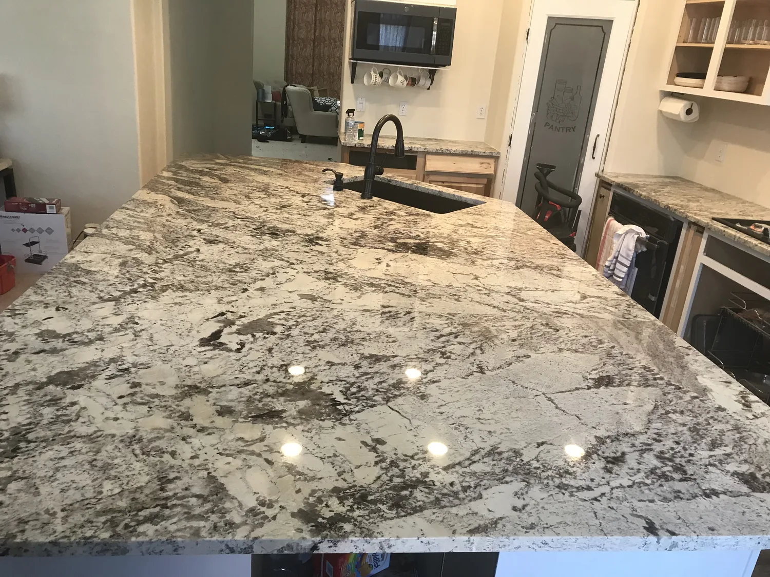 Light granite island with polished surface