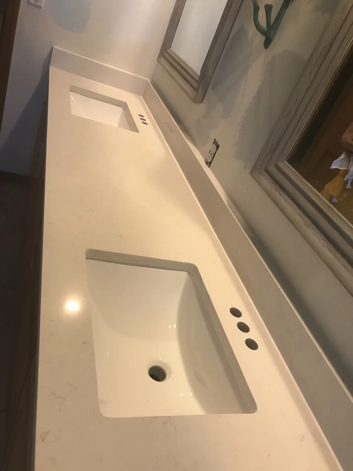 Long white stone counter with integrated sink