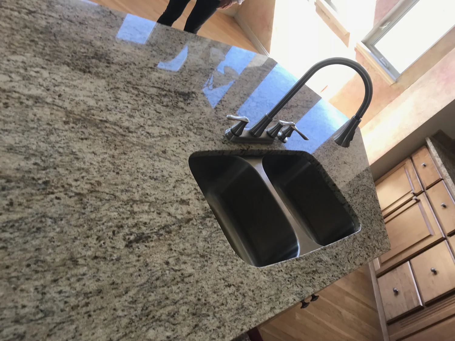 Polished countertop with sink and faucet detail