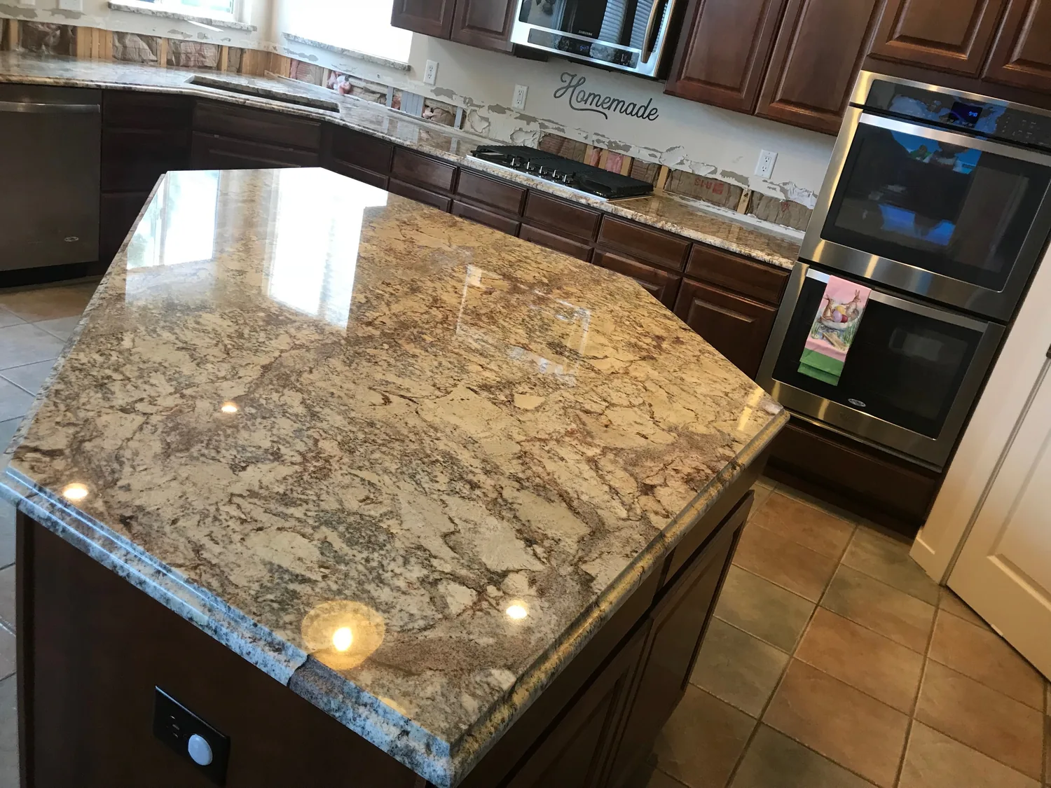 Rounded granite island surface with finished edge